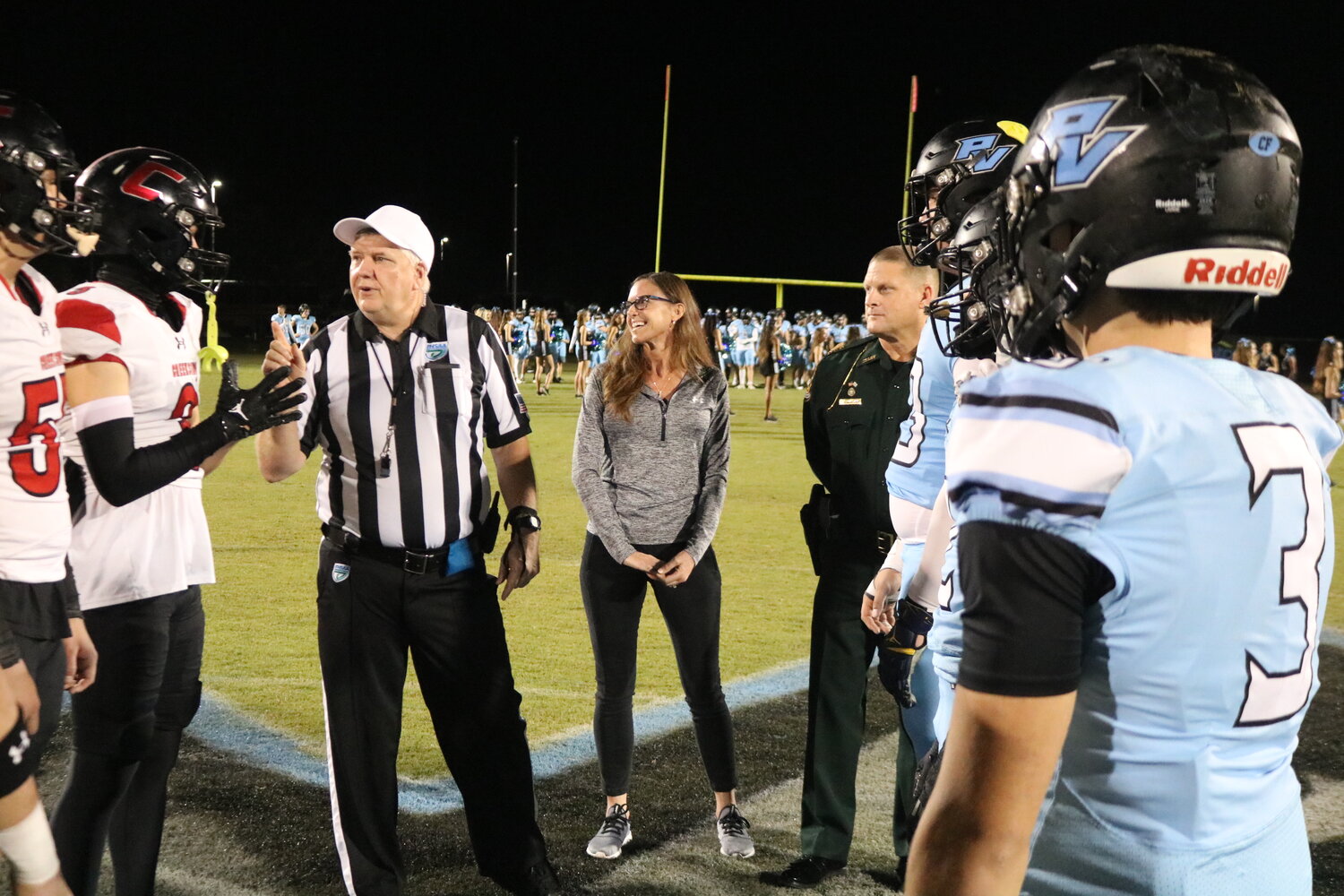 St. Johns County Sheriff Robert Hardwick and his wife Kendell were on hand for the coin toss.